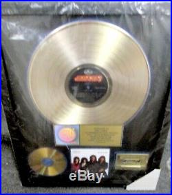 Kiss, Lick It Up Riaa Gold Record Award To Kiss Eric Carr. Gene Simmons