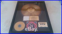 Kiss rock and roll over riaa gold record award presented to eric carr